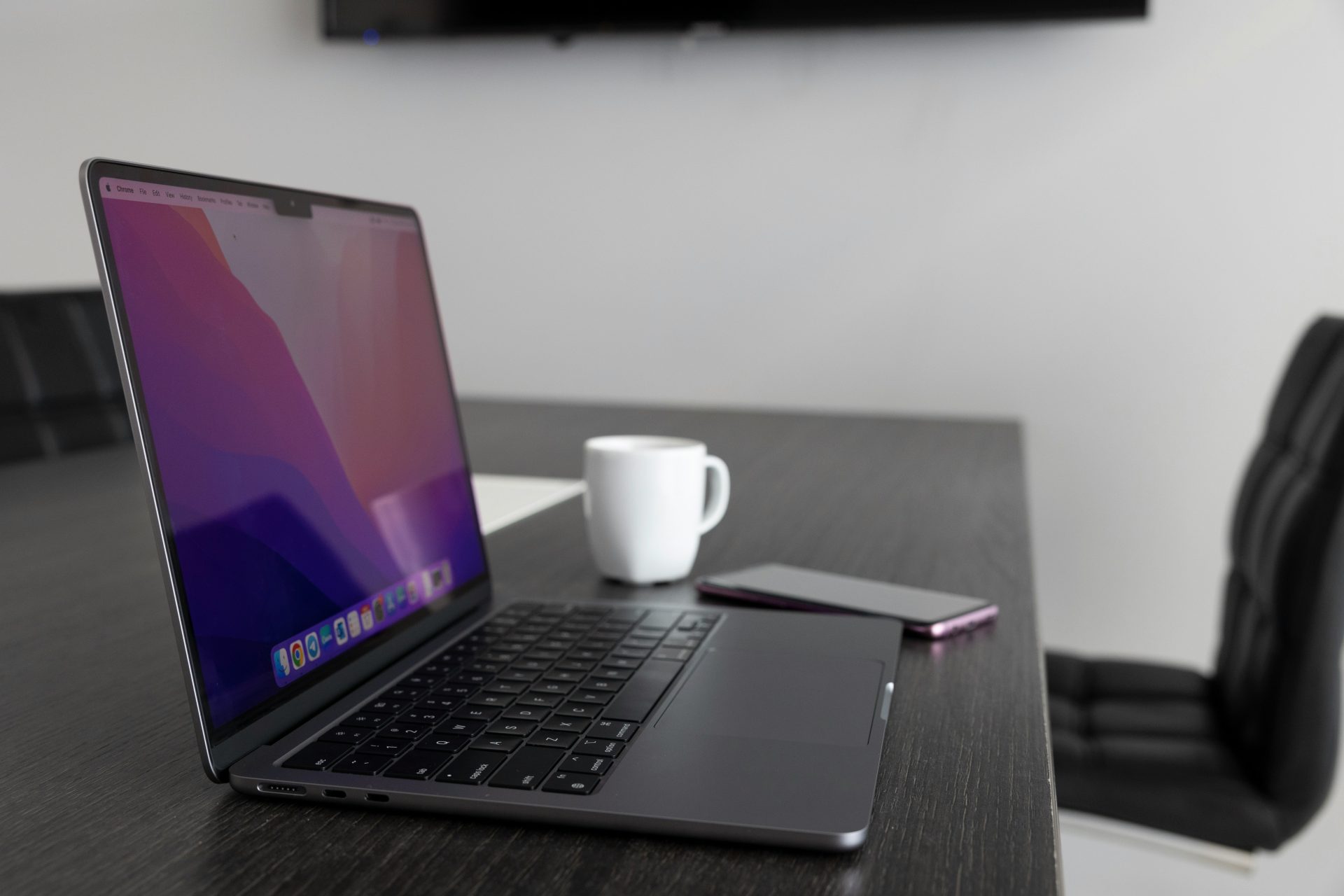 a laptop and a cup of coffee